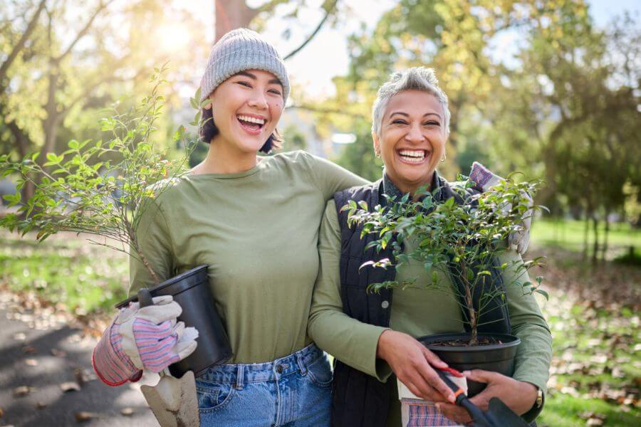 Two women gardening to de-stress with mother nature.
