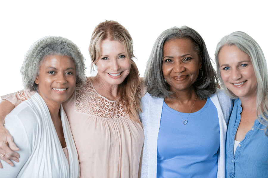 Embrace Diversity - Four senior women of different colors embracing each other
