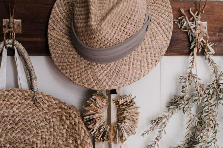 Design Compassion with handmade natural fiber items such as a hat, hanging dried flowers and a bag.