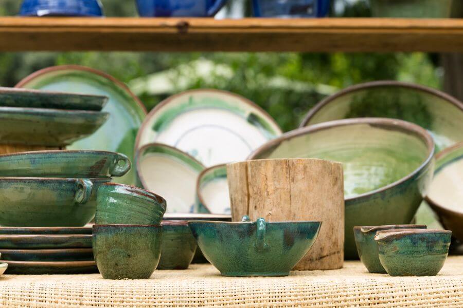 Design Compassion with Green earth ware dishes.