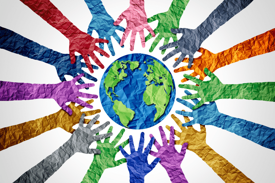 Embrace Diversity - Multi-colored hands all reaching towards and around the globe
