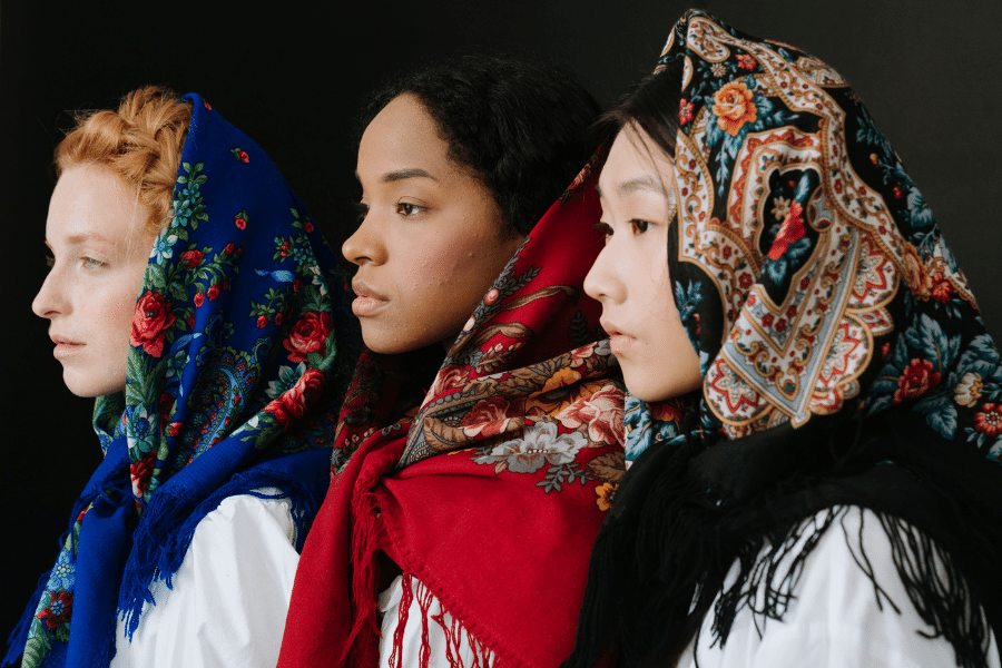 Embrace Diversity - Three young women of different ethnic background wearing beautiful scarves